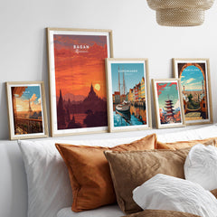 Bagan Travel Poster – Myanmar Ancient Temple Sunset Art displayed alongside other travel posters on a cozy bed.