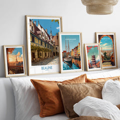 Beaune France Print – Hospices de Beaune Wall Art displayed among framed travel prints on a cozy sofa.