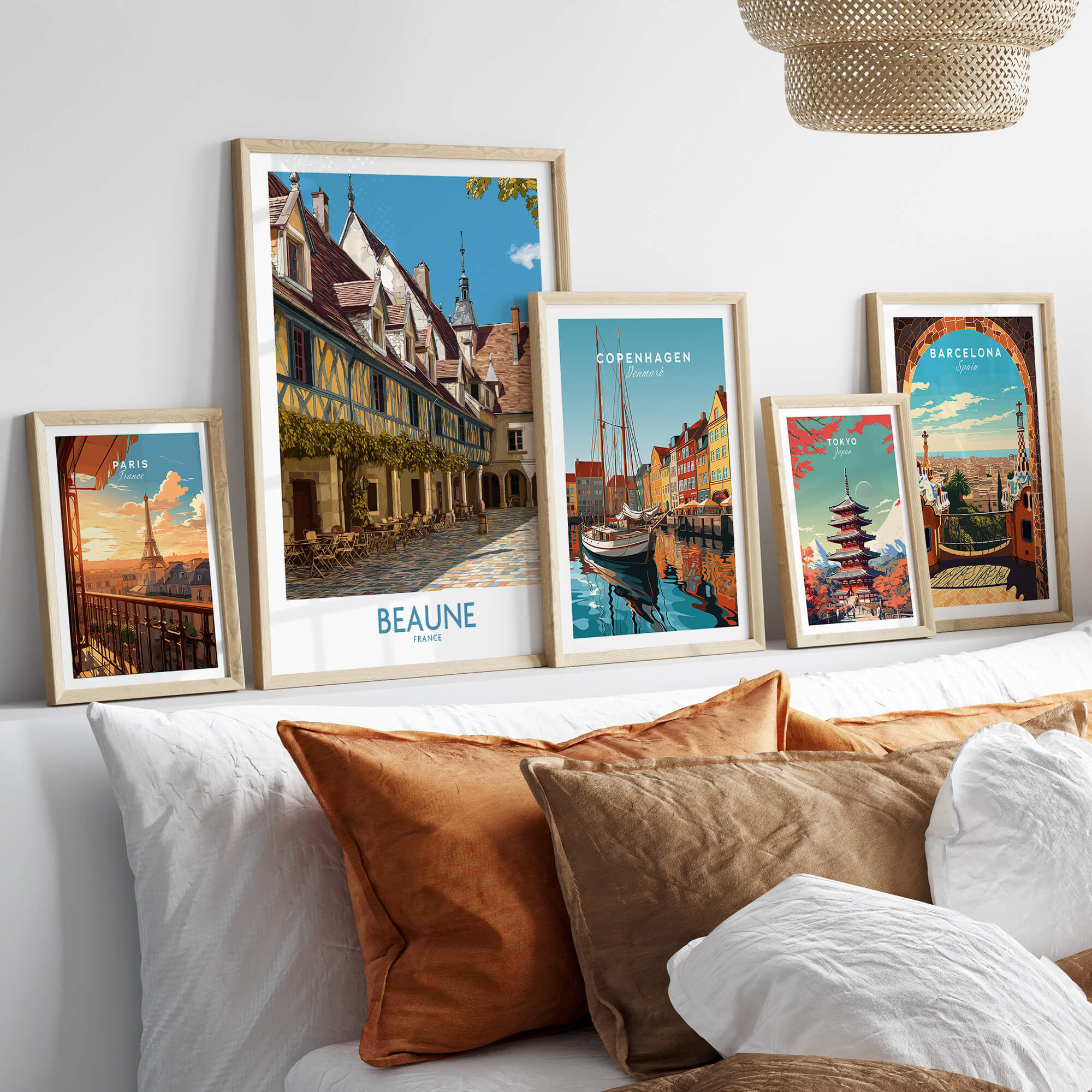 Beaune France Print – Hospices de Beaune Wall Art displayed among framed travel prints on a cozy sofa.