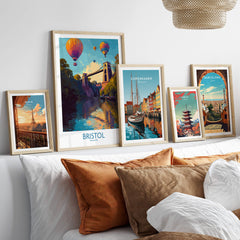 Bristol England Wall Art – River Avon Sunset and Balloon Festival Print displayed among other city art prints on a stylish shelf.