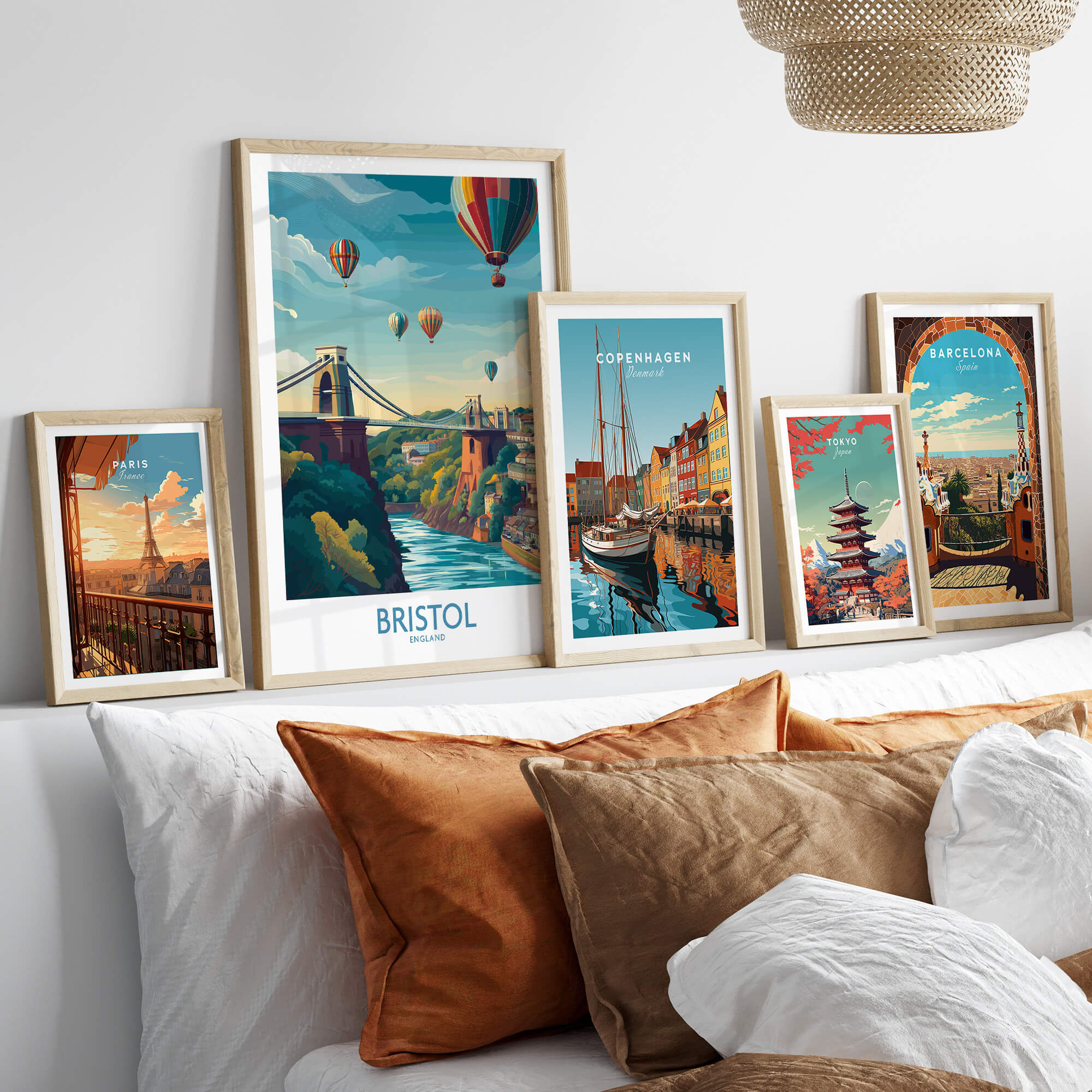 Bristol Canvas Print - Wall Art Poster displayed among framed cityscape art on a cozy couch with decorative pillows.