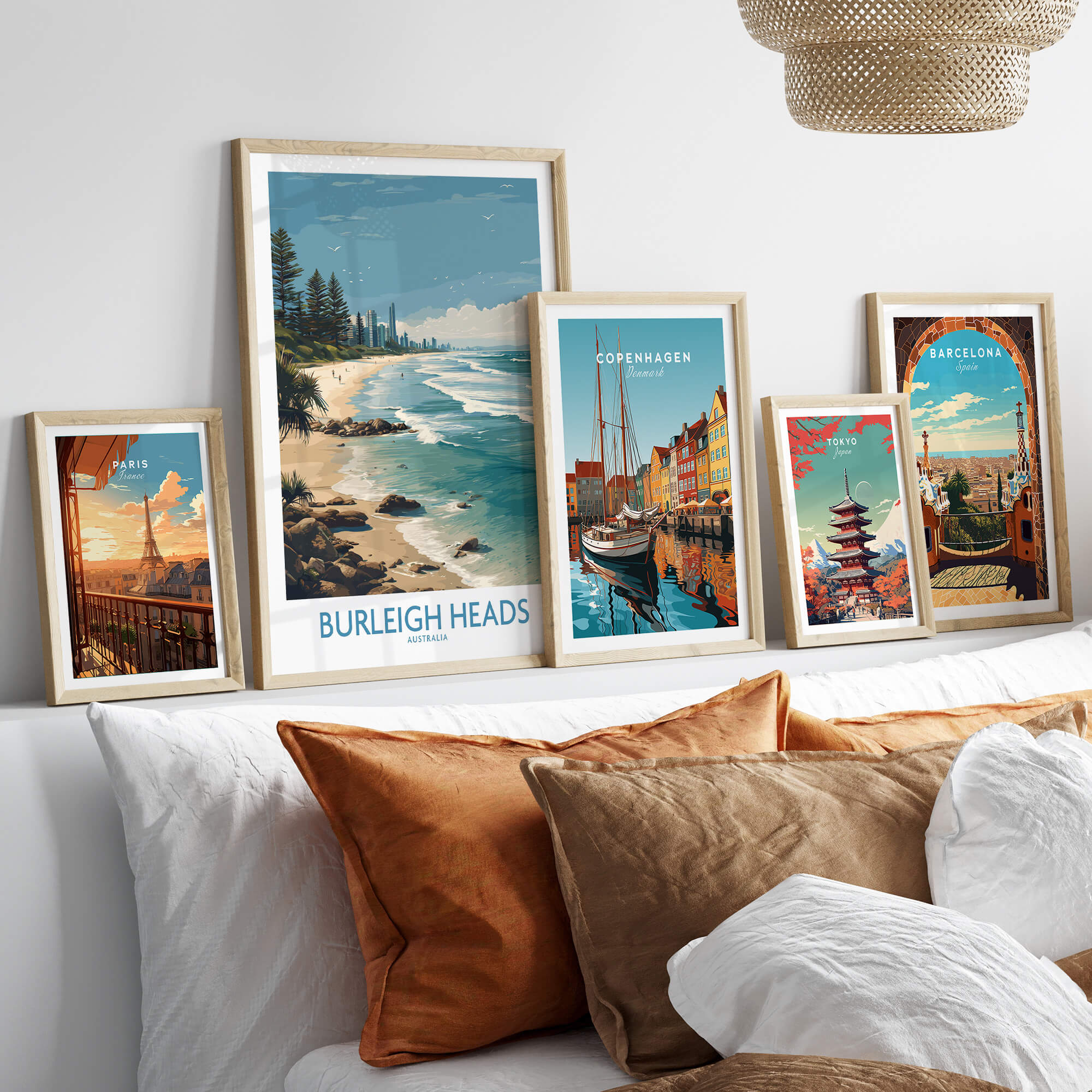Burleigh Heads Travel Poster - Canvas Print displayed among other travel posters on a modern shelf.