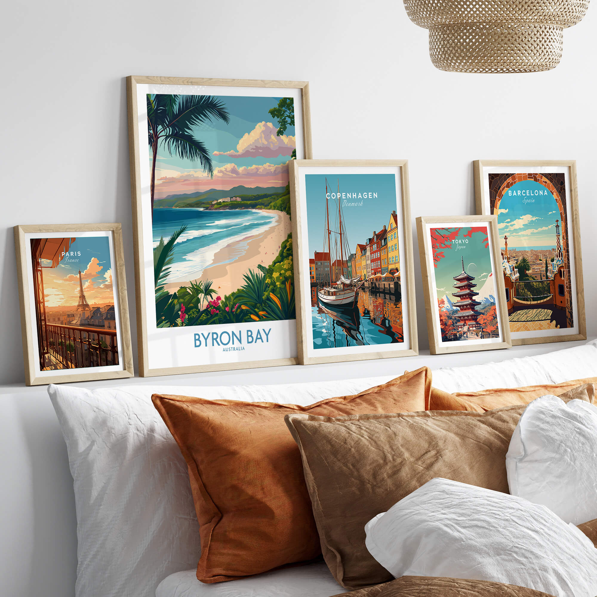 Byron Bay Poster - Australia Wall Art displayed among other travel posters on a stylish living room wall.