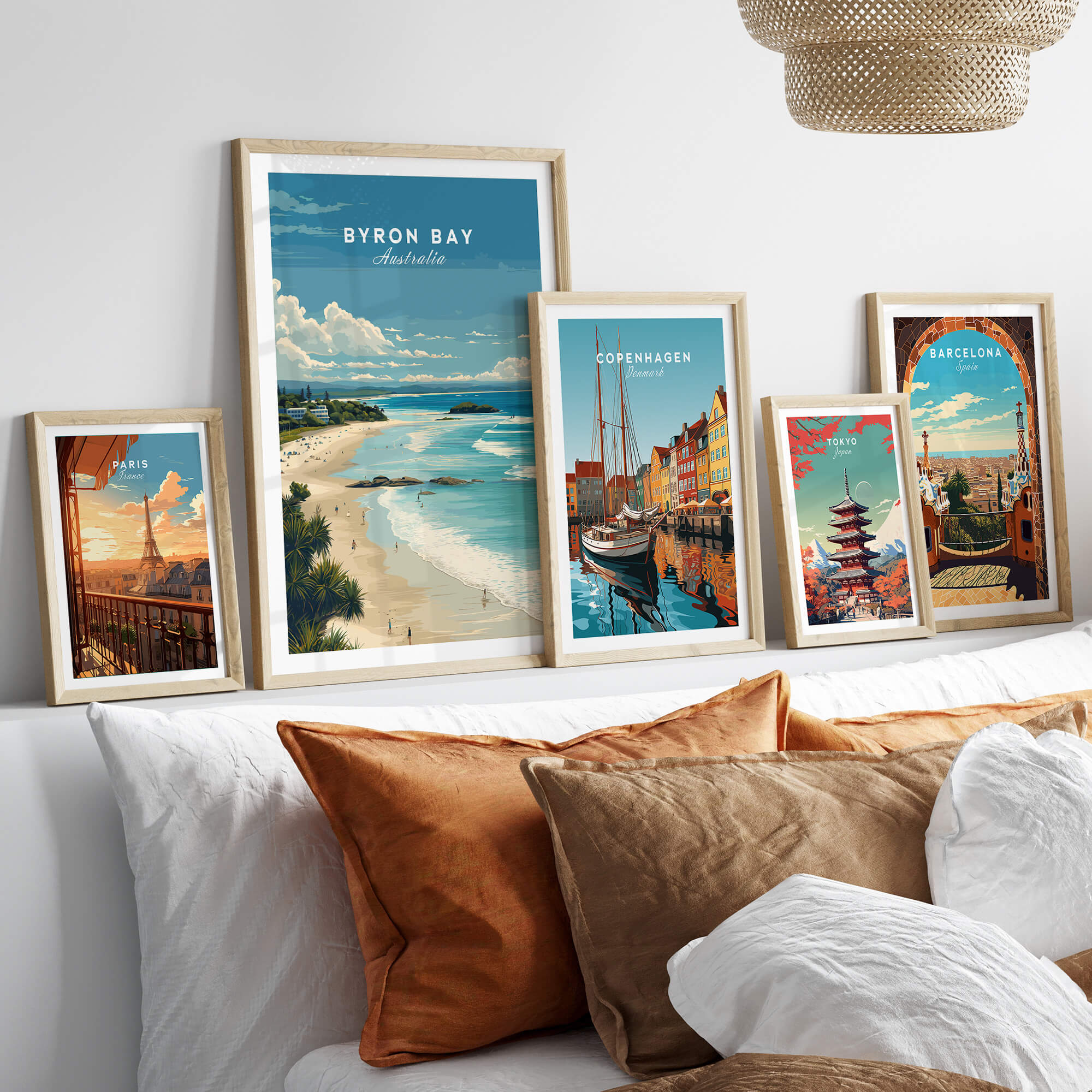 Byron Bay Poster - Canvas Beach Print displayed on a wall with other travel posters, enhancing home decor.