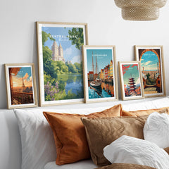 Set of five framed travel posters above bed, featuring Central Park, Paris, Copenhagen, Tokyo, Barcelona.