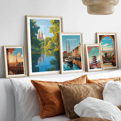Framed travel posters of Central Park, Paris, Copenhagen, Tokyo, and Barcelona above a bed