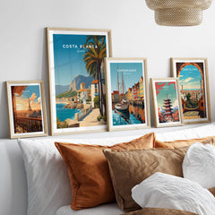Costa Blanca Travel Poster - Spain Canvas Print displayed in framed art on a stylish sofa arrangement.