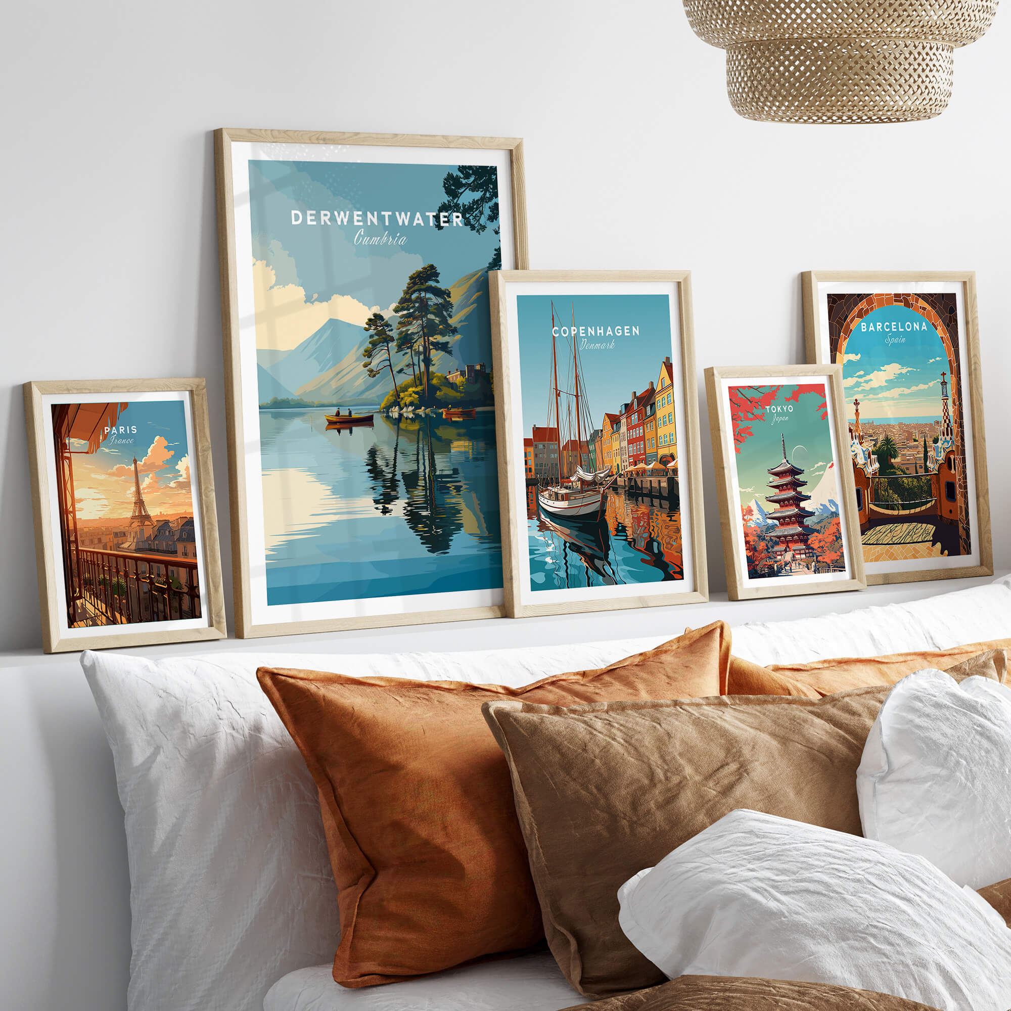 Derwentwater Print – Lake District Sunset Poster displayed among other travel prints in a cozy decor setting.