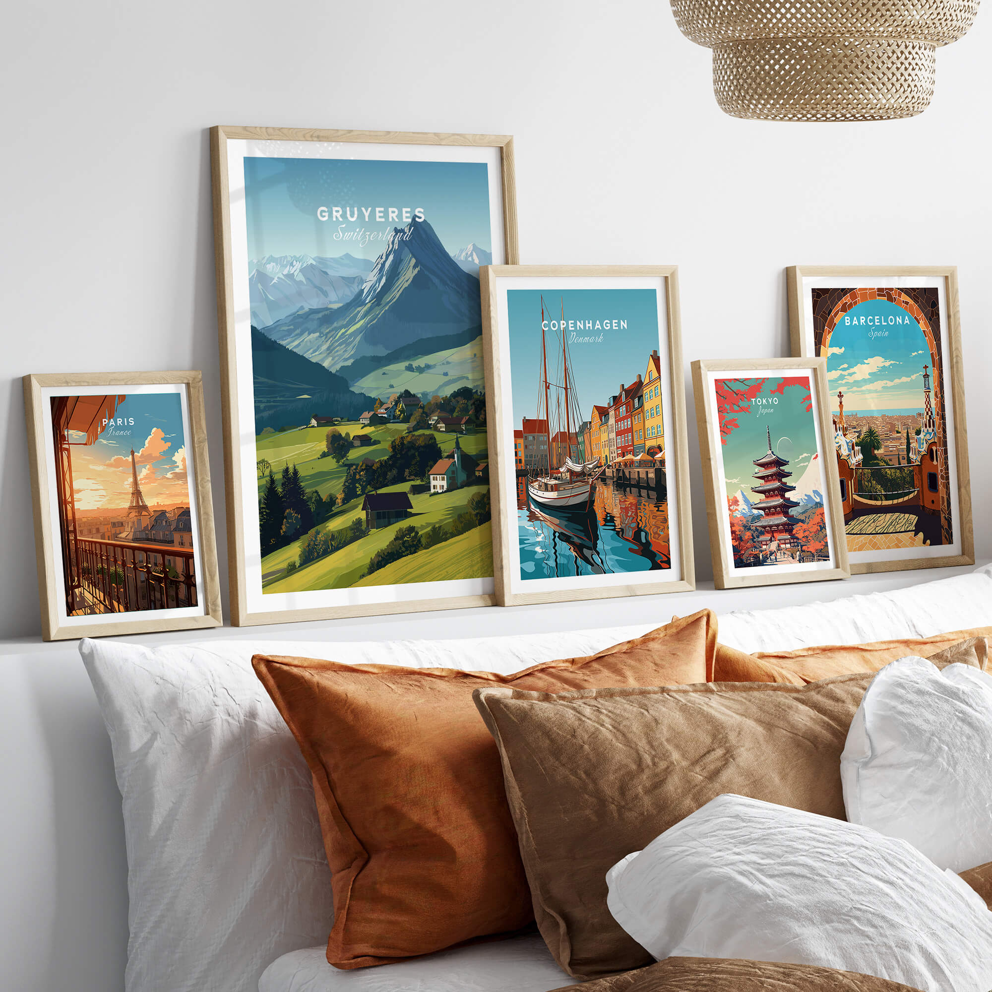 Gruyères Switzerland Travel Poster | Mountain Landscape Wall Art Print displayed among other travel posters on a cozy sofa.