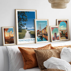 Honeymoon Island Florida Poster | Gulf Coast Landscape Canvas Print displayed among travel posters on a cozy couch.