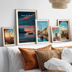 Isle of Islay Scotland Travel Posters | Highland Coastal House Wall Art Print displayed in stylish frames on a cozy bed.