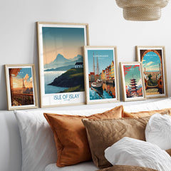 Isle of Islay Scotland Canvas & Art Print displayed among various framed artwork on a stylish sofa.