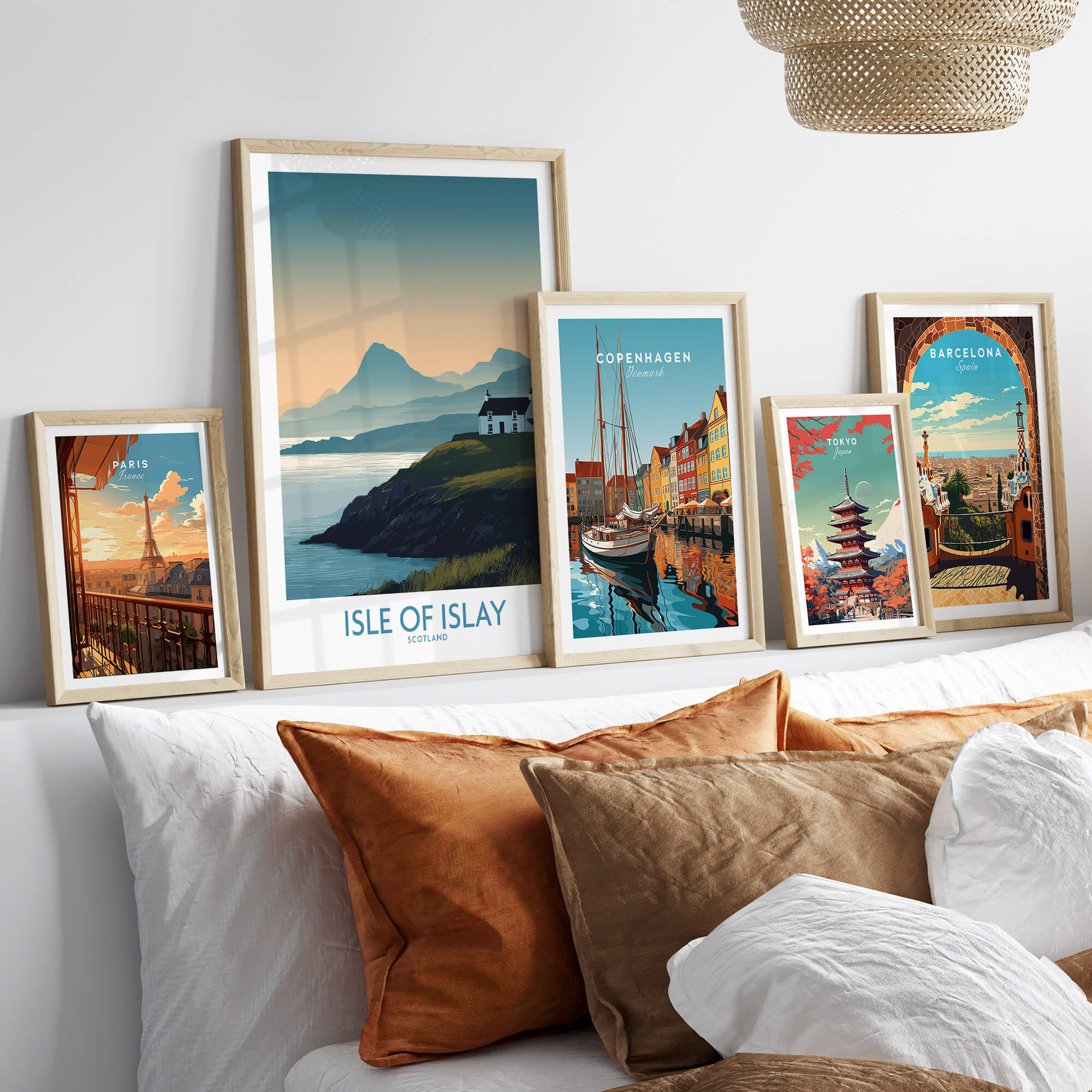 Isle of Islay Scotland Canvas & Art Print displayed among various framed artwork on a stylish sofa.