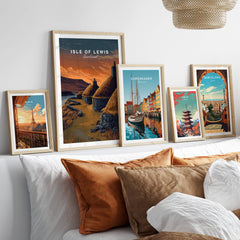 Isle of Lewis Scotland Travel Poster | Blackhouse Village Wall Art Print displayed among other travel posters in a stylish living room setting.