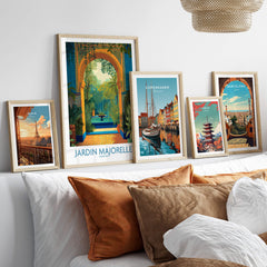 Jardim Majorelle Marrakesh Canvas Print | Tropical Oasis Landscape Poster displayed among other framed travel art on a cozy couch.