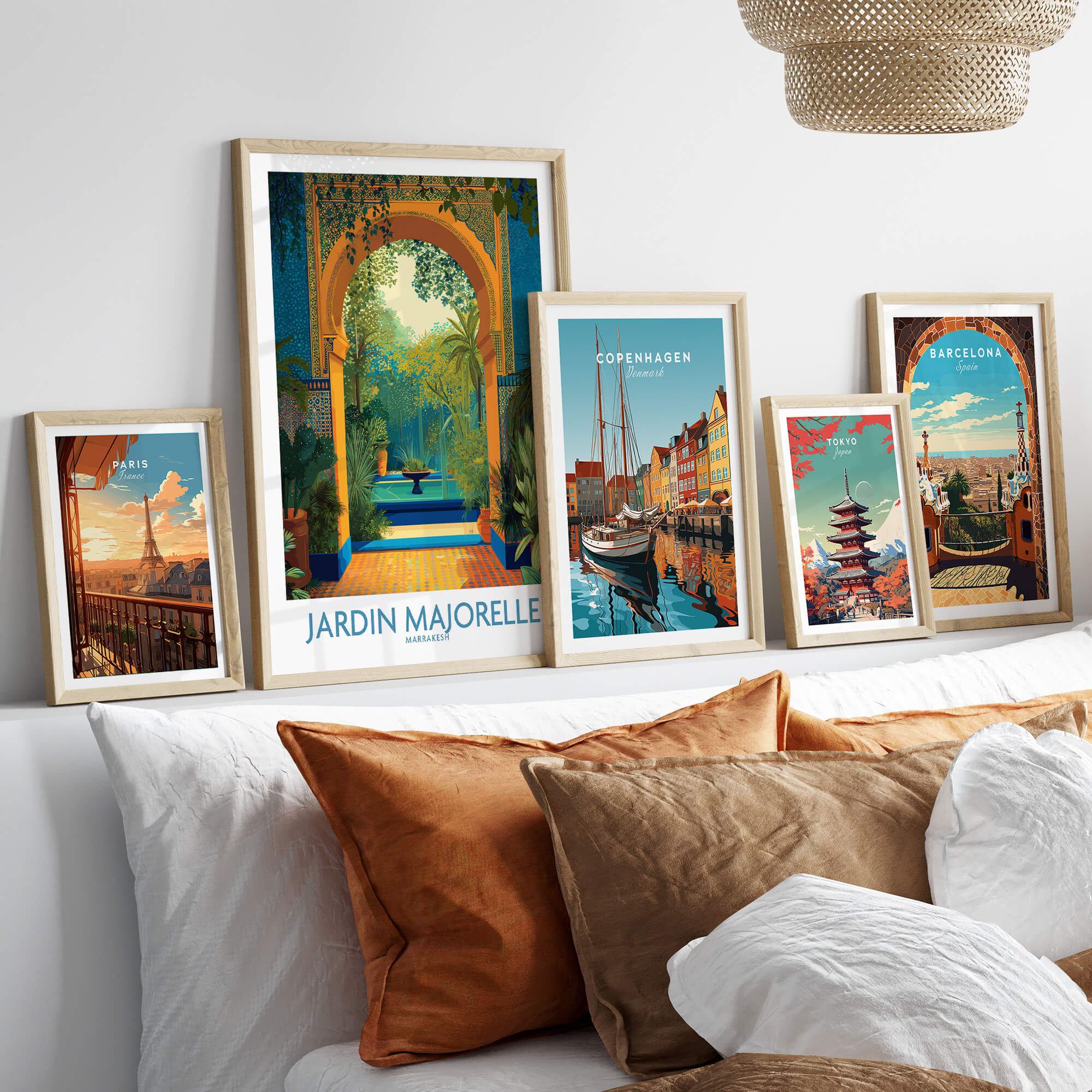 Jardim Majorelle Marrakesh Canvas Print | Tropical Oasis Landscape Poster displayed among other framed travel art on a cozy couch.