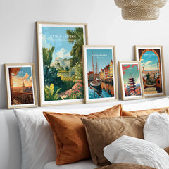 Set of five framed travel art prints above bed, including Paris, Kew Gardens, Copenhagen, Tokyo, Barcelona.