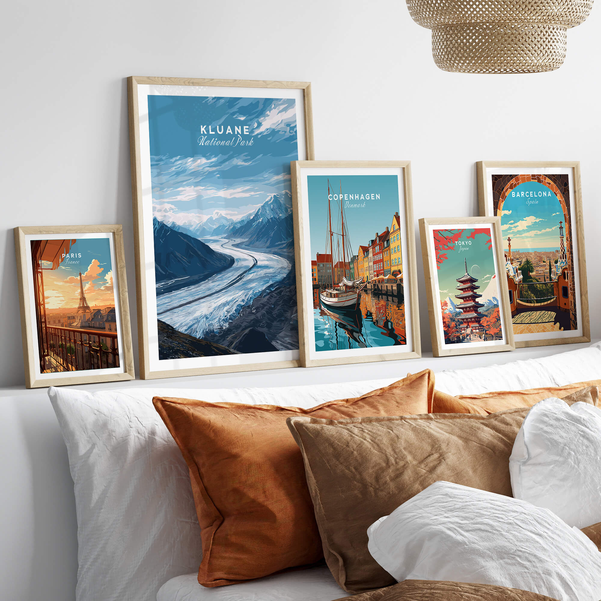 Kluane Wall Art Print National Park Canada | Yukon Glacier Landscape Travel Poster displayed among other travel posters on a cozy bed.