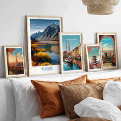 Kluane National Park Canada Canvas Print | Mountain Poster displayed among various travel posters on a stylish sofa.