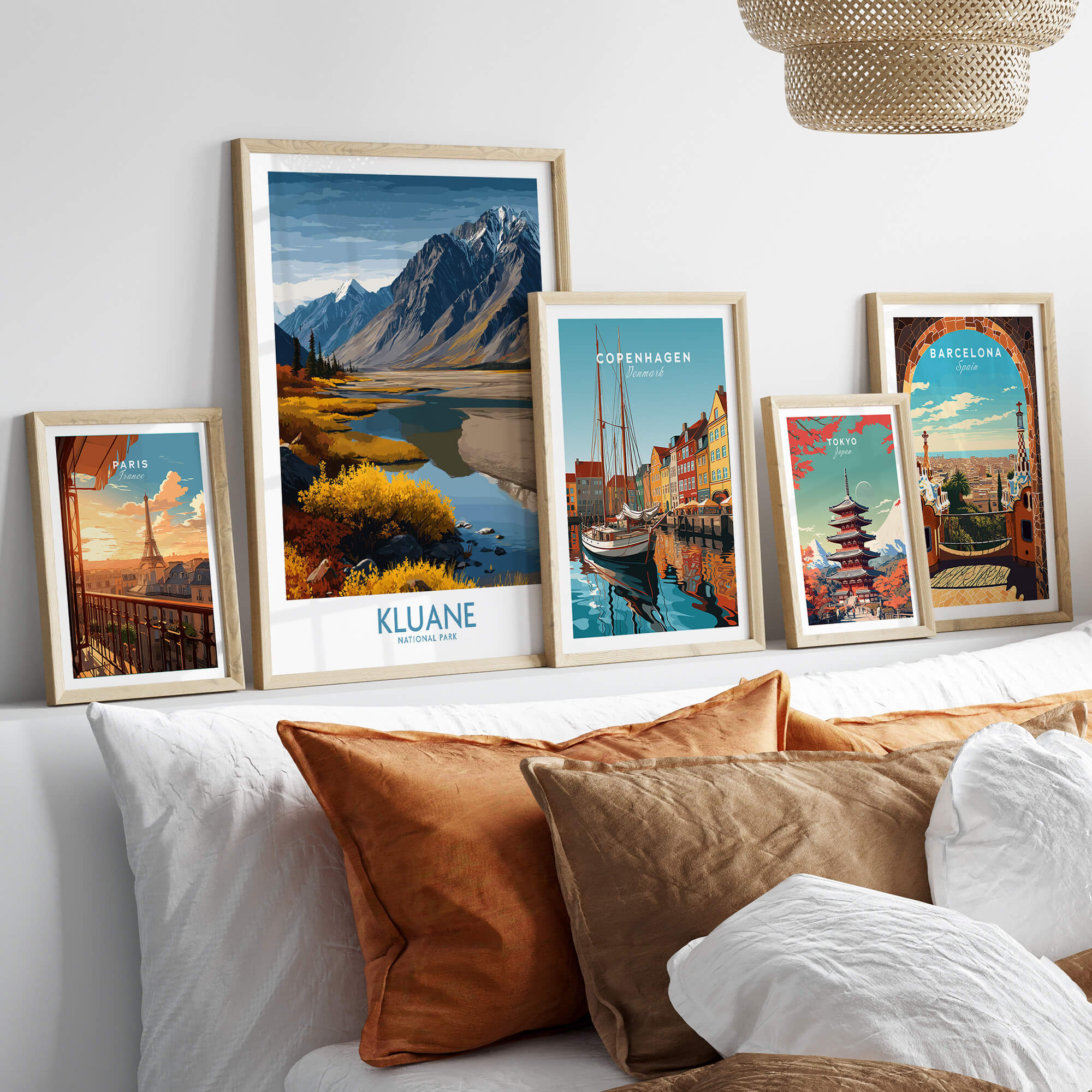 Kluane National Park Canada Canvas Print | Mountain Poster displayed among various travel posters on a stylish sofa.