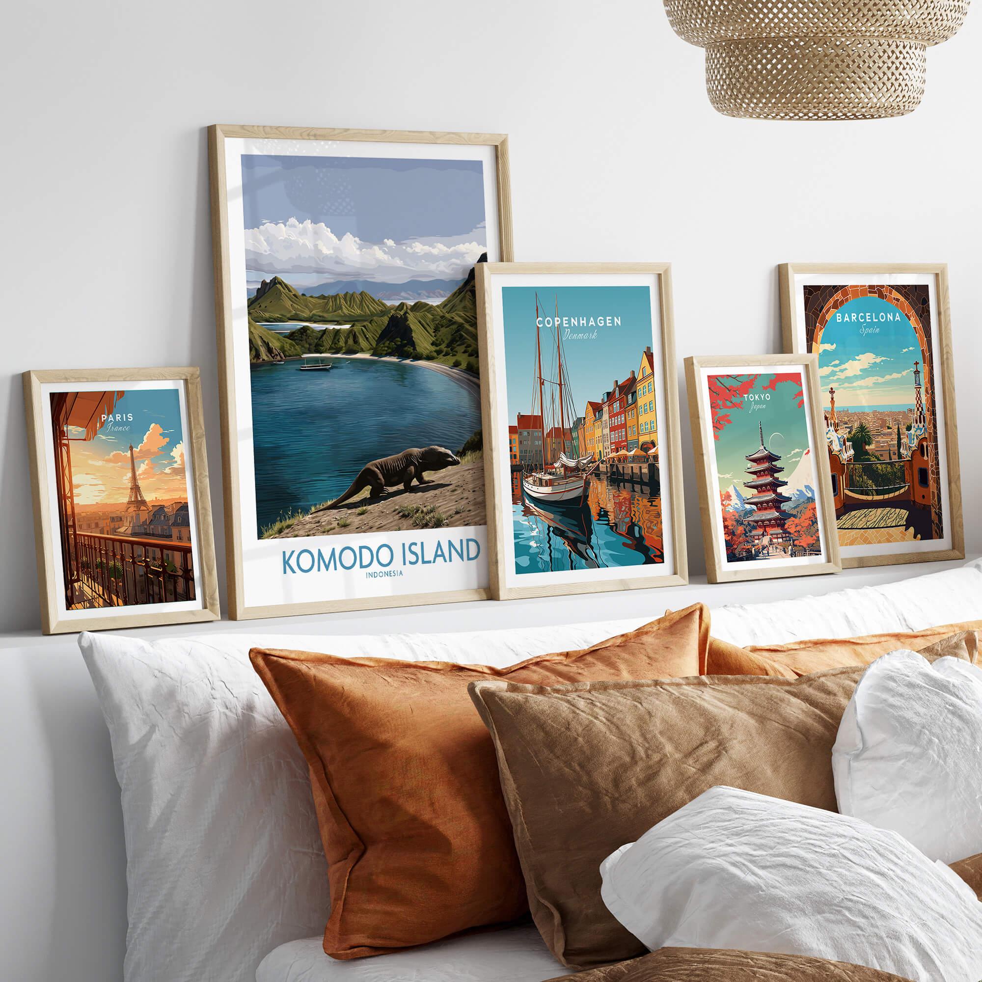 Set of five framed travel posters above bed, featuring Paris, Komodo Island, Copenhagen, Tokyo, and Barcelona.