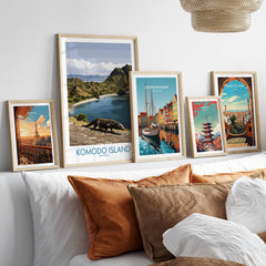 Framed travel posters for Komodo Island, Paris, Copenhagen, Tokyo, and Barcelona above a bed