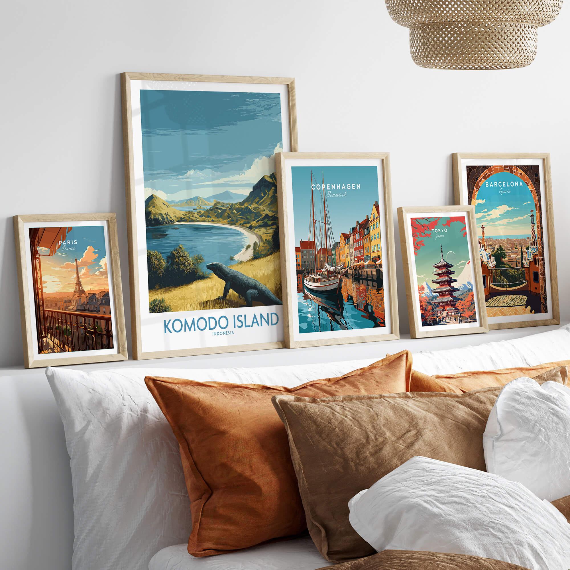 Framed travel posters of Paris, Komodo Island, Copenhagen, Tokyo, and Barcelona above a bed