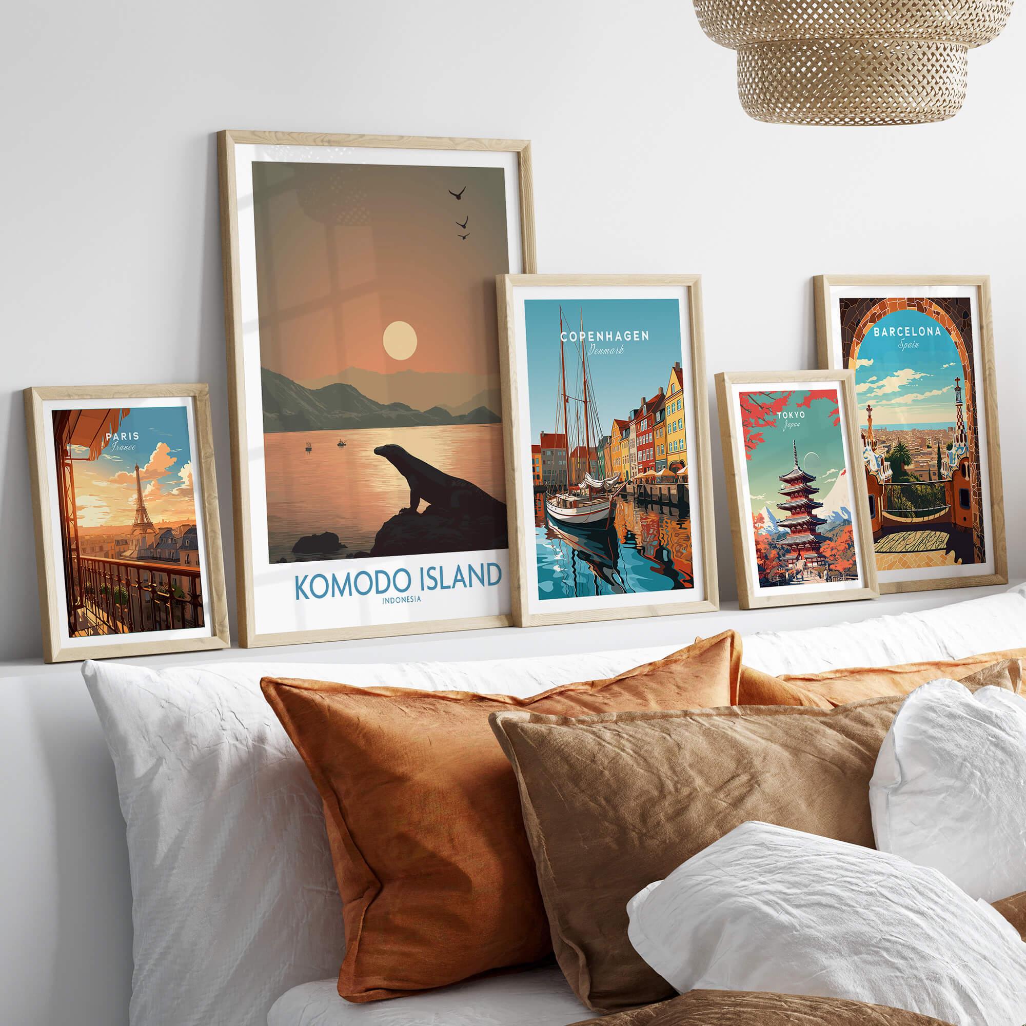 Set of five framed travel posters above bed, featuring Paris, Komodo Island, Copenhagen, Tokyo, and Barcelona.