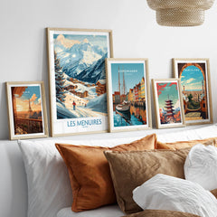 Framed travel posters above bed, featuring Paris, Les Menuires, Copenhagen, Tokyo, Barcelona.