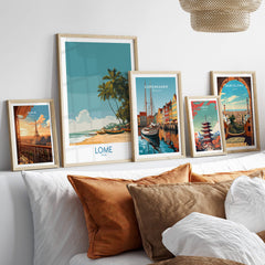 Lomé Togo Canvas Print | Tropical Coastal Village Scene Posters displayed in stylish frames on a modern sofa.