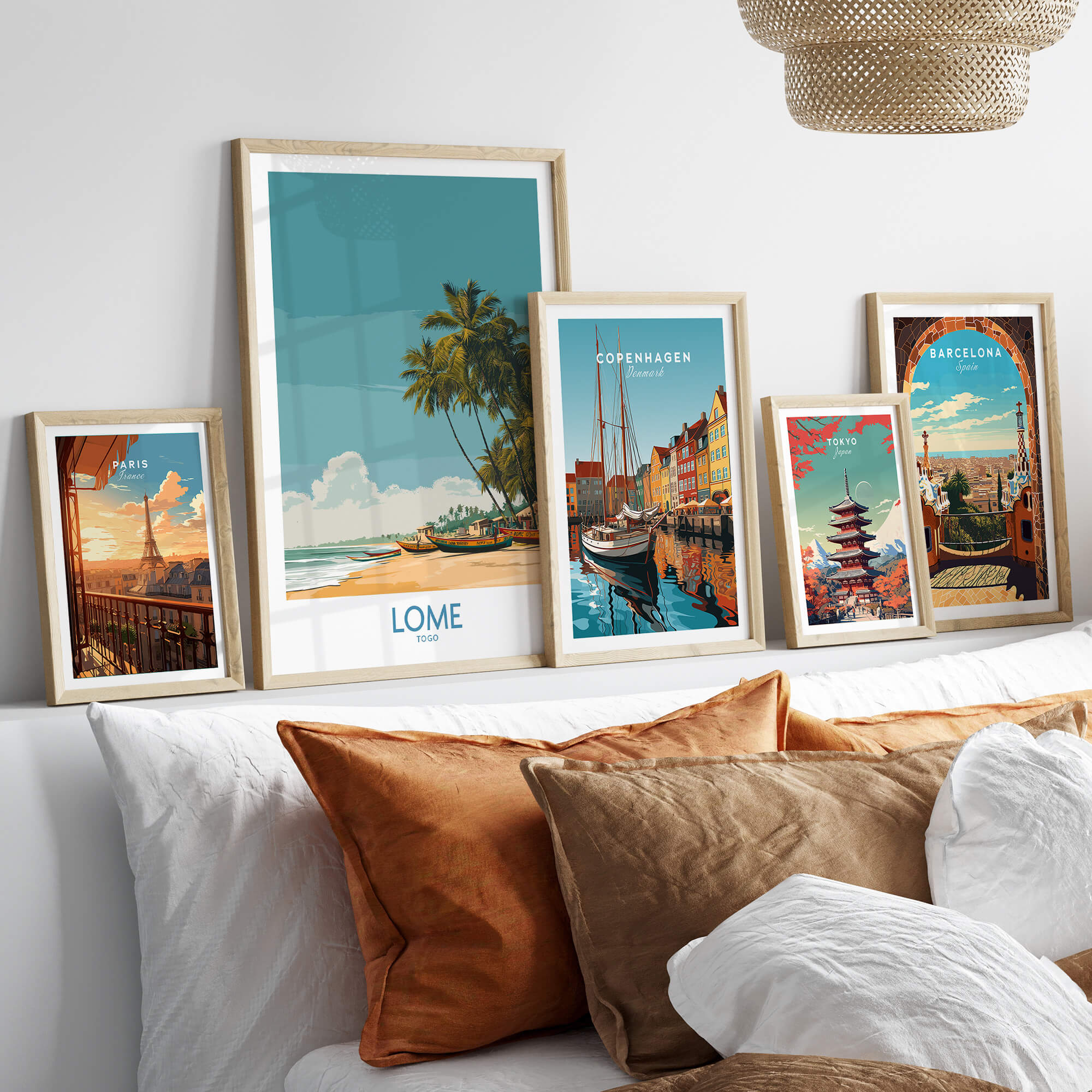 Lomé Togo Canvas Print | Tropical Coastal Village Scene Posters displayed in stylish frames on a modern sofa.