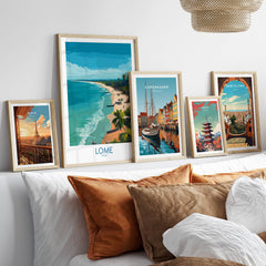 Lomé Togo Poster | West African Coastline Canvas Print displayed among other travel posters on a sofa.