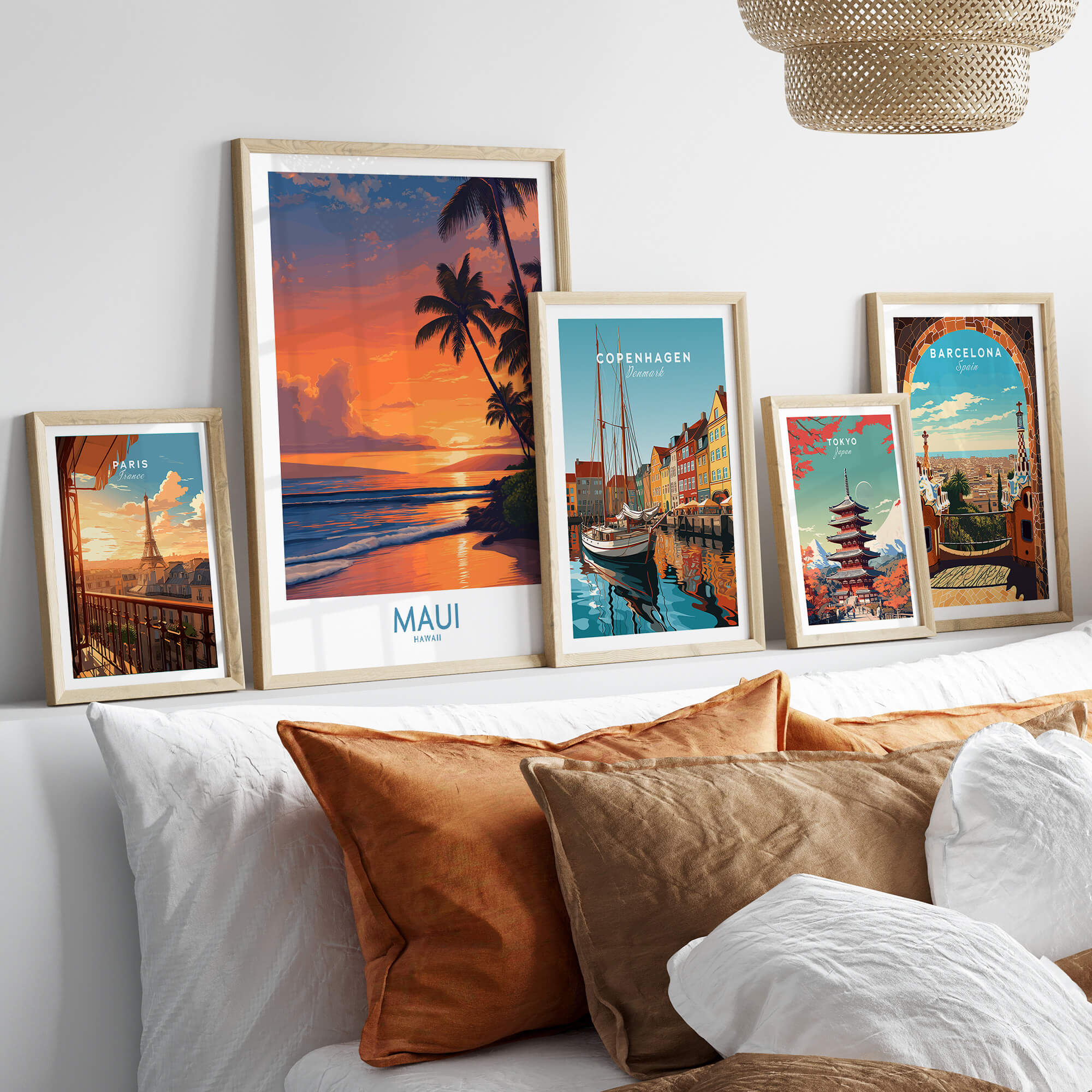 Maui Hawaii Poster | Vibrant Island Coastline Scene Canvas Print displayed among other travel posters on a stylish couch.