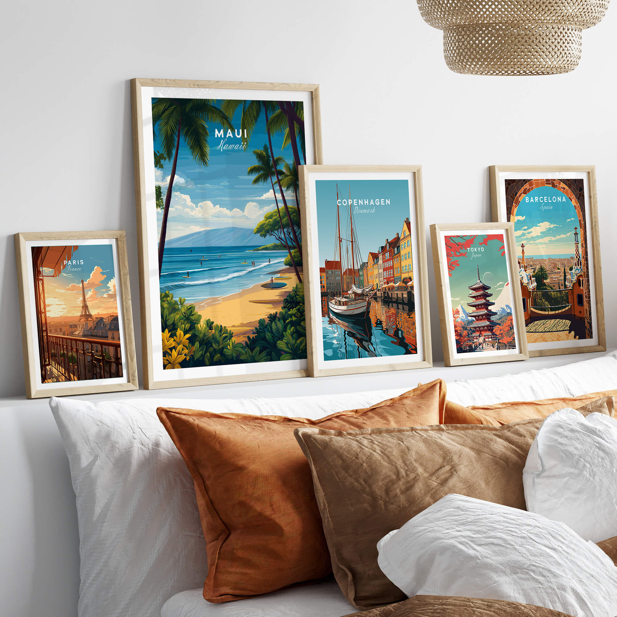 Maui Hawaii Travel Poster | Sunny Surfing Beach Wall Art Print displayed among other travel posters on a cozy sofa.