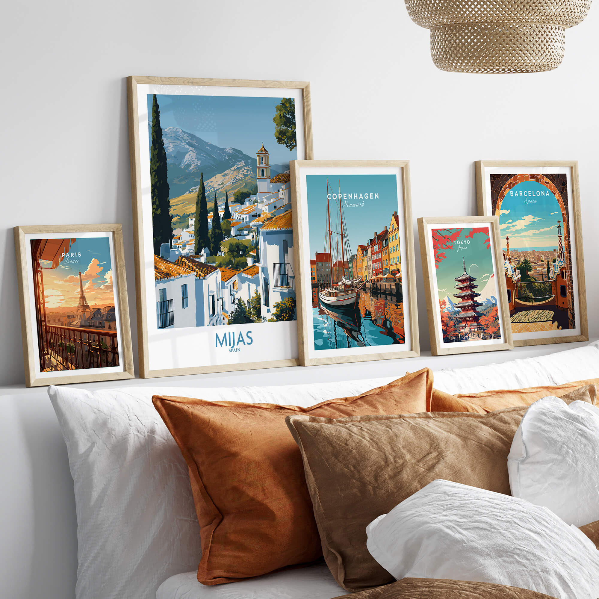 Mijas Spain Poster | Scenic Mountain Town Landscape Canvas Print displayed alongside other travel posters in a stylish interior setting.