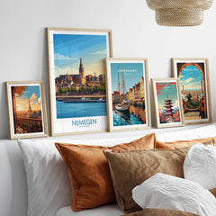 Framed travel posters for Paris, Nijmegen, Copenhagen, Tokyo, and Barcelona above a bed