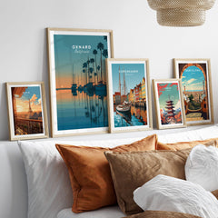 Oxnard California Wall Art Print | Sunset Harbor & Sailboats Travel Poster displayed in stylish frames on a couch