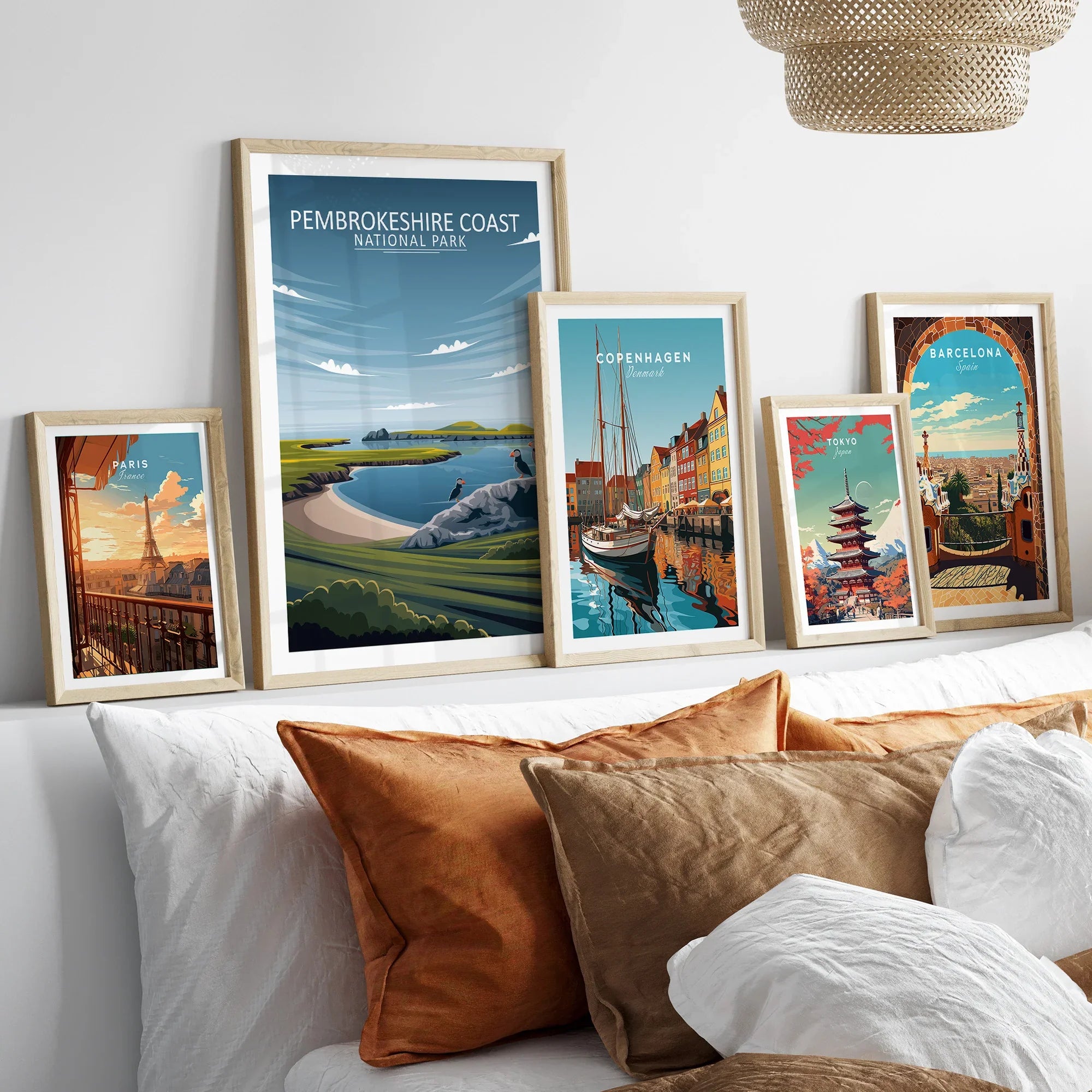 Set of five travel poster framed art prints above bed, city and national park wall decor