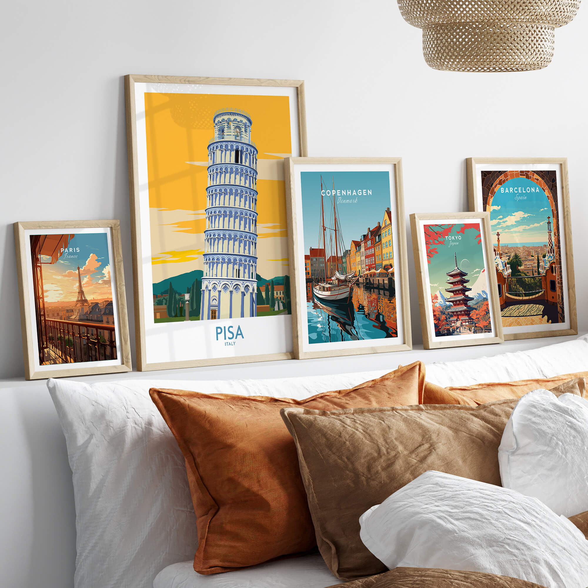 Pisa Tower Italy Print displayed among other city prints on a stylish bed decor.