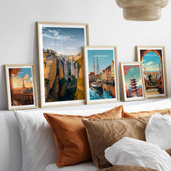 Ronda Spain Wall Art Print | Historic White Village Cliffside Travel Poster displayed in a modern living room with decorative pillows.