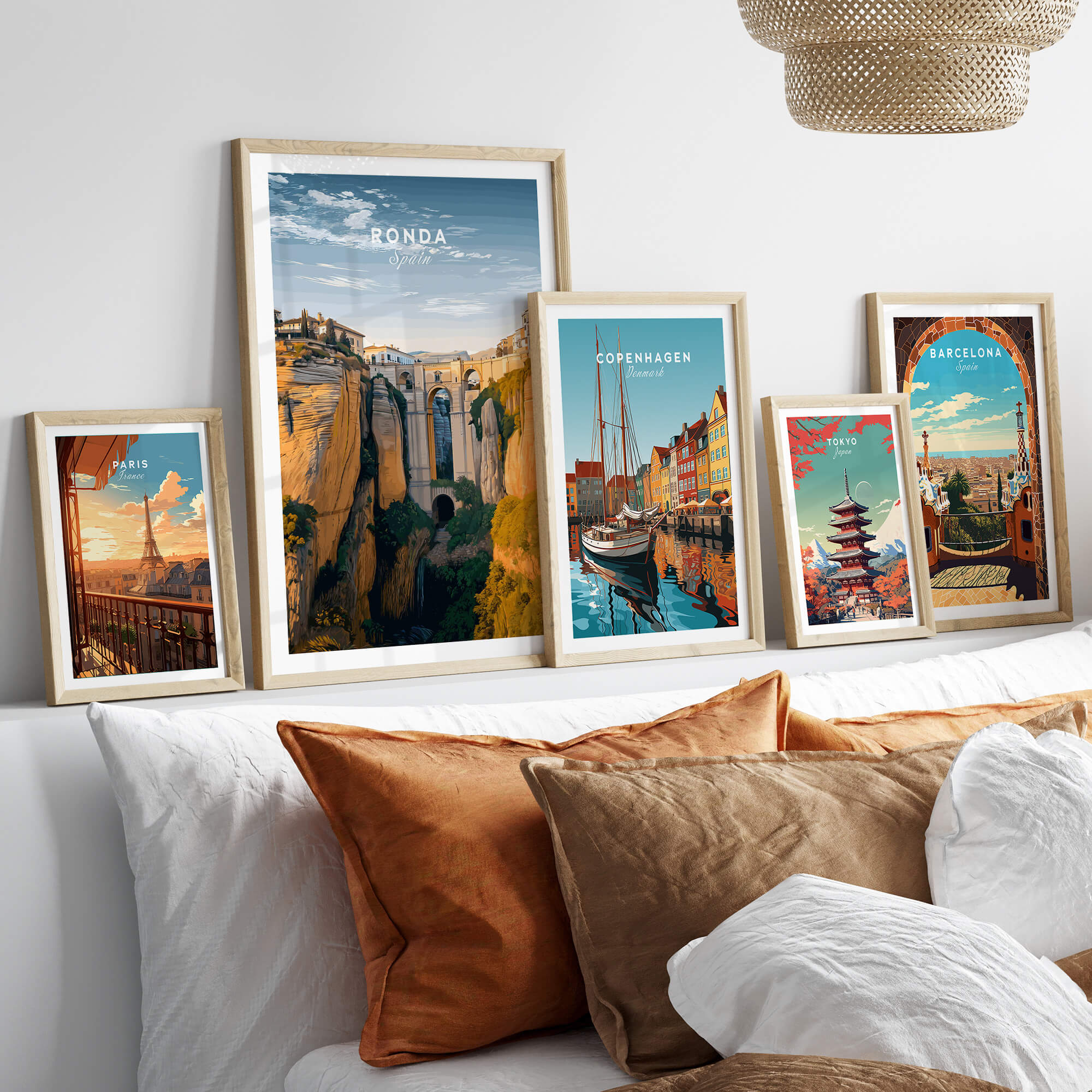 Ronda Spain Wall Art Print | Historic White Village Cliffside Travel Poster displayed in a modern living room with decorative pillows.
