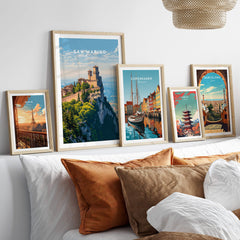 San Marino Wall Art Print | Mount Titano Citadel Travel Poster framed among other travel posters on a stylish sofa.