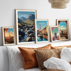 Scafell Pike Poster Lake District Wall Art Print displayed with travel-themed prints on a stylish bed.