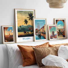 Sri Lanka Poster | Tropical Palm Tree & Elephant Canvas Print displayed among other city posters on a stylish couch.