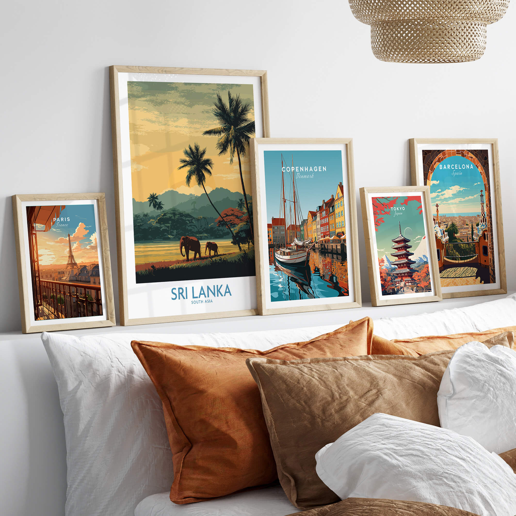 Sri Lanka Poster | Tropical Palm Tree & Elephant Canvas Print displayed among other city posters on a stylish couch.