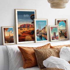 Uluru Australia Wall Art Print | Red Center Outback Travel Poster displayed among other framed travel posters.