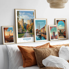 Set of five framed travel posters above bed, featuring Paris, Windsor, Copenhagen, Tokyo, Barcelona.