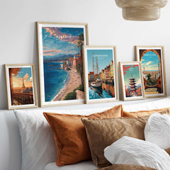 Ajaccio Canvas Print | French Travel Wall Decor displayed among other travel prints on a stylish wall above a cozy sofa.