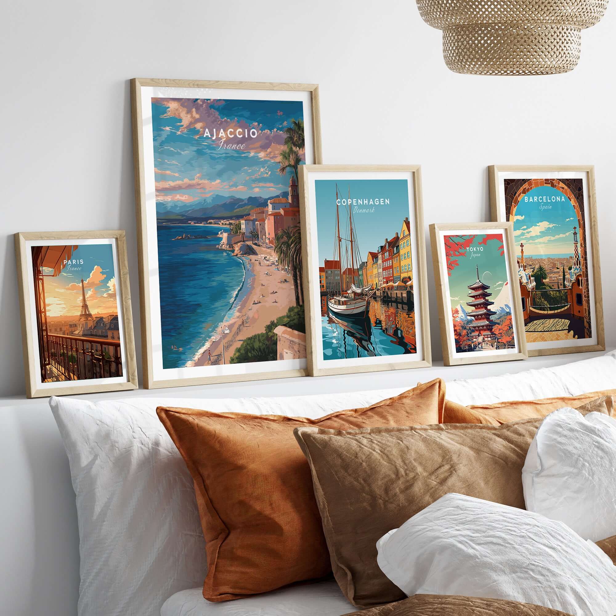 Ajaccio Canvas Print | French Travel Wall Decor displayed among other travel prints on a stylish wall above a cozy sofa.