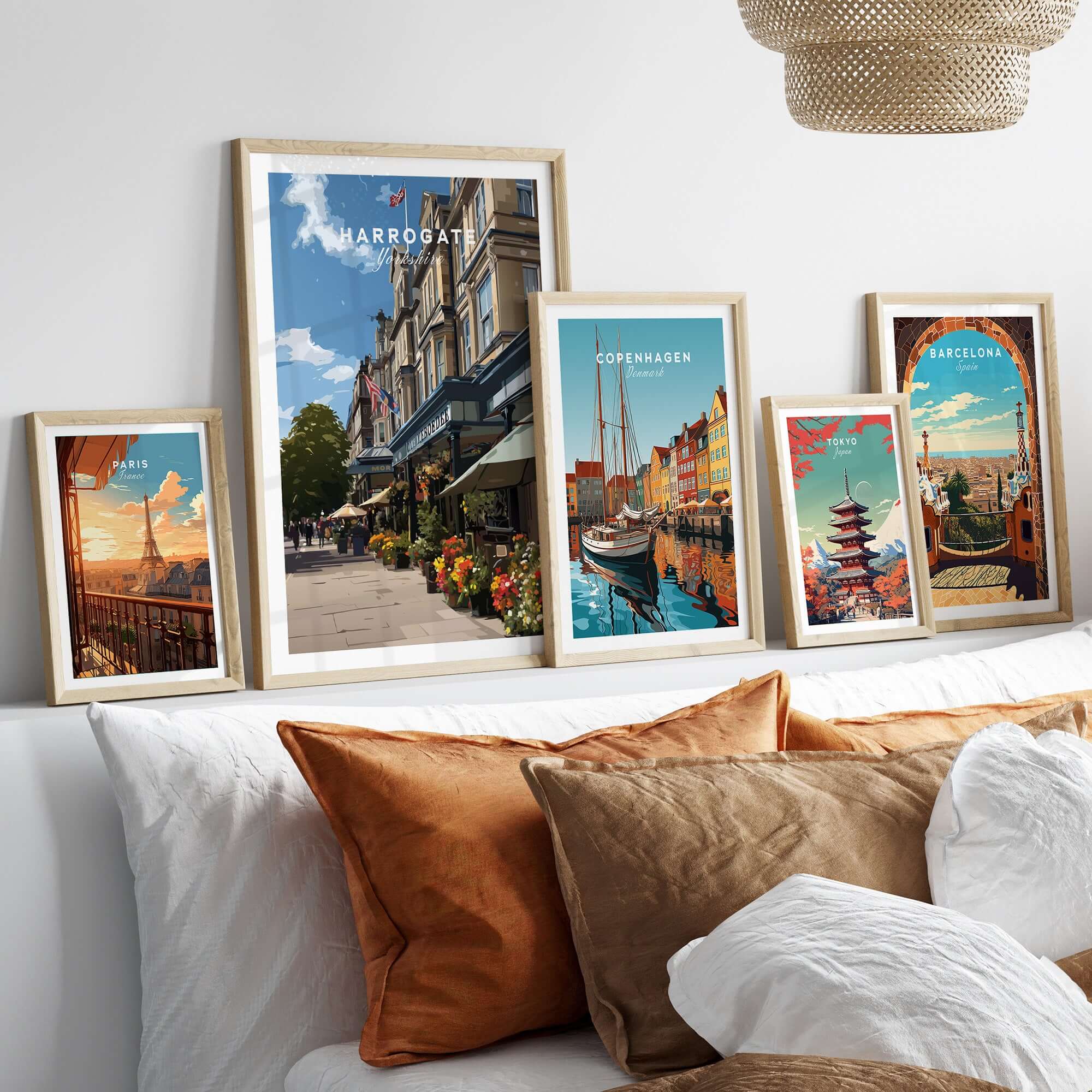 Harrogate Street View Print | Yorkshire Home Decor displayed among other city prints on a cozy couch.